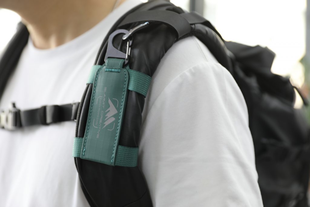 Summit Creative Tenzing Speedy camera clip strap mounted on a backpack shoulder strap